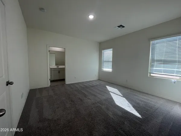 a view of empty room with windows