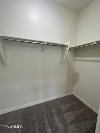 a view of an empty walk in closet