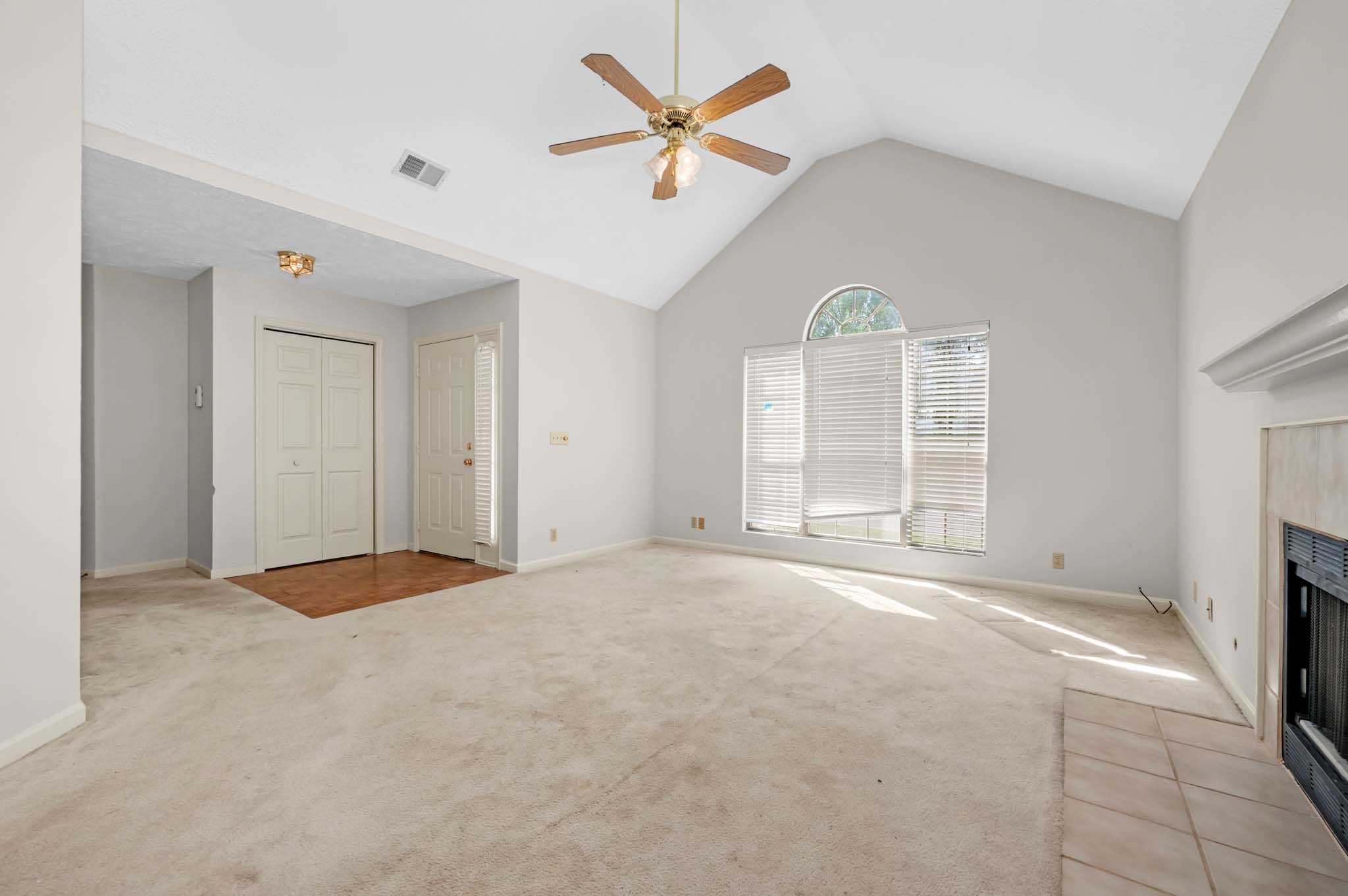 3624 Burwick Place Antioch, TN 37013 - Photo 11 of 31 an empty room with chandelier fan and windows