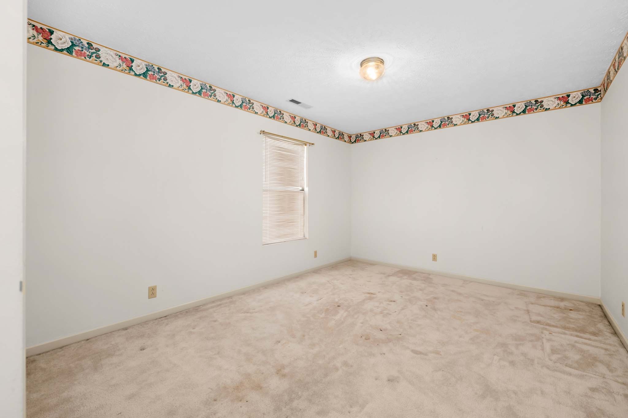 3624 Burwick Place Antioch, TN 37013 - Photo 16 of 31 a view of a room with racks on the wall and a window