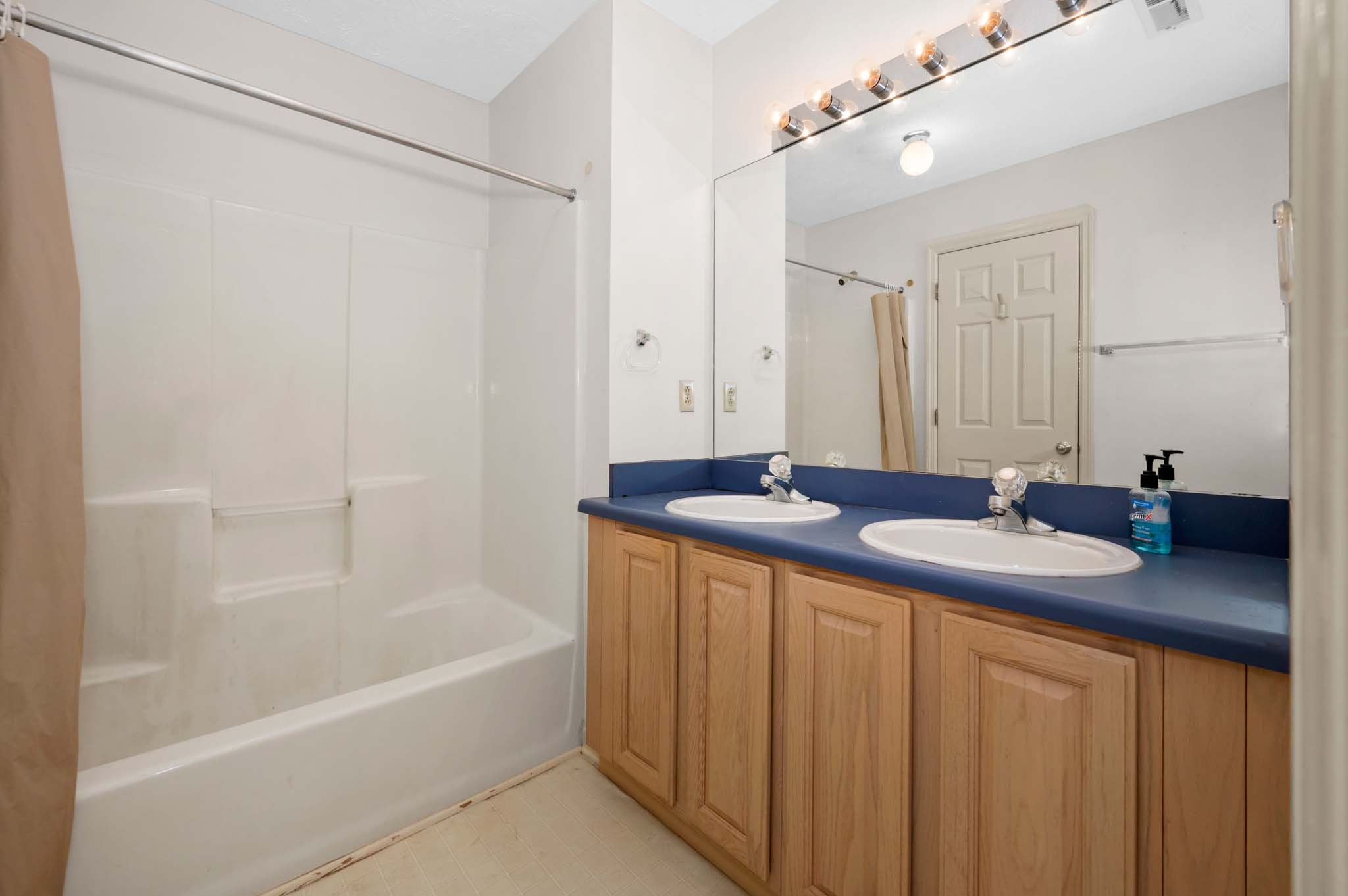 3624 Burwick Place Antioch, TN 37013 - Photo 25 of 31 a bathroom with a granite countertop sink and a bathtub