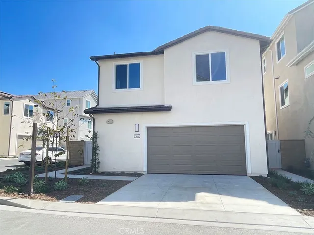 a view of a house with a street
