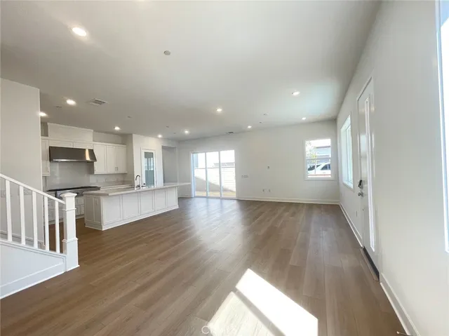 a view of kitchen with sink and wooden floor