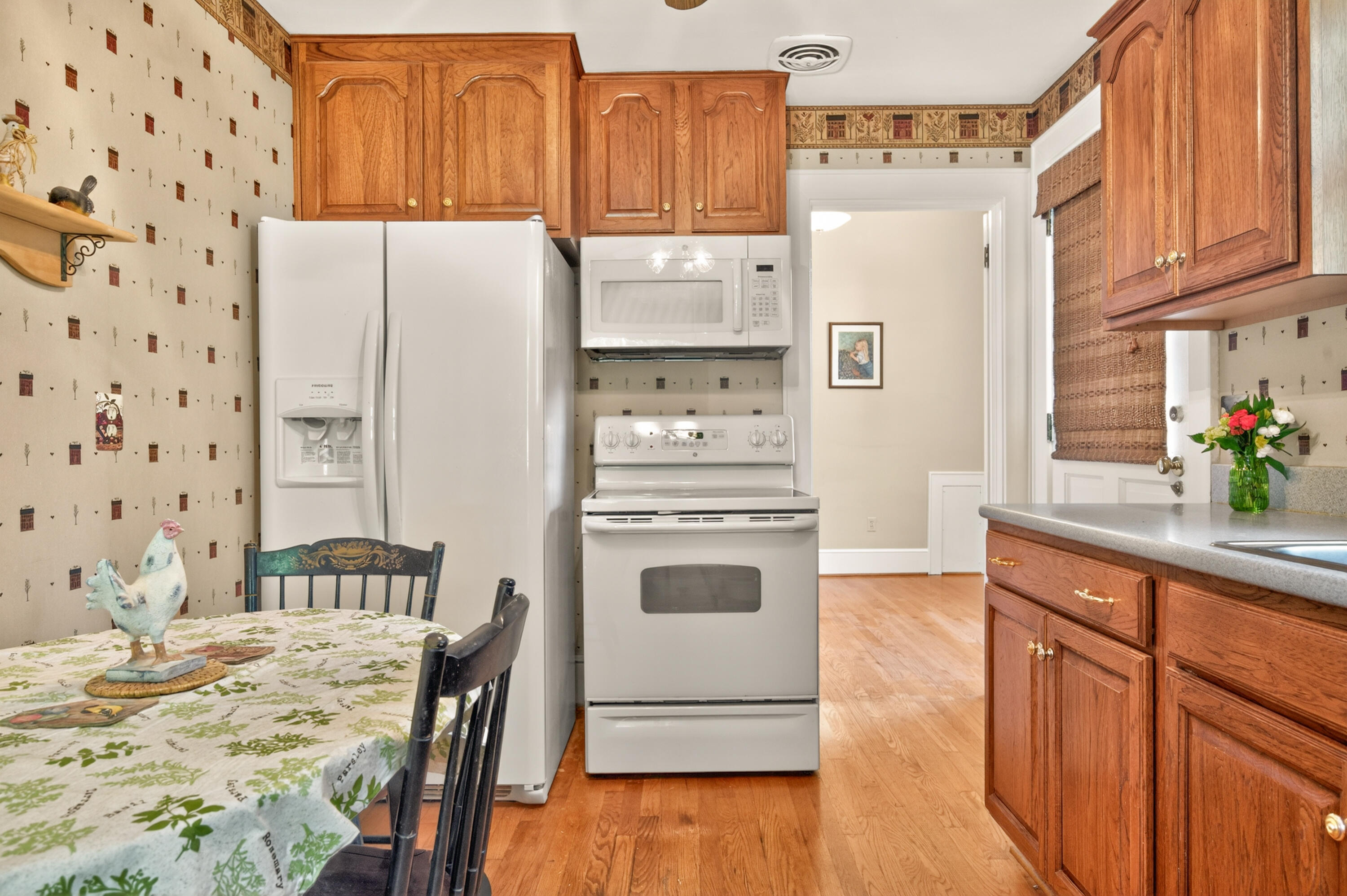 4322 Rosecrest Road Roanoke, VA 24018 - Photo 21 of 36 a kitchen with granite countertop a refrigerator and a stove top oven