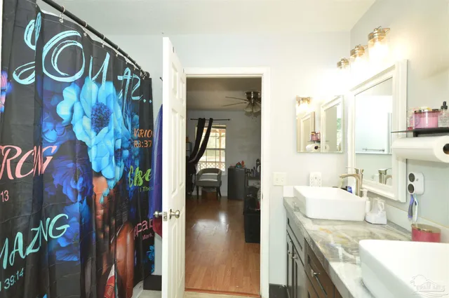a en suite bathroom with a sink and a mirror