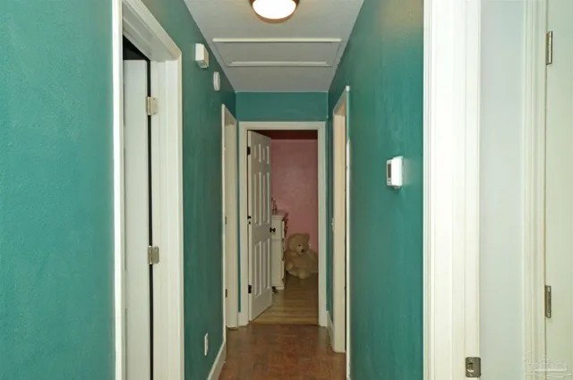a view of a bathroom from a hallway
