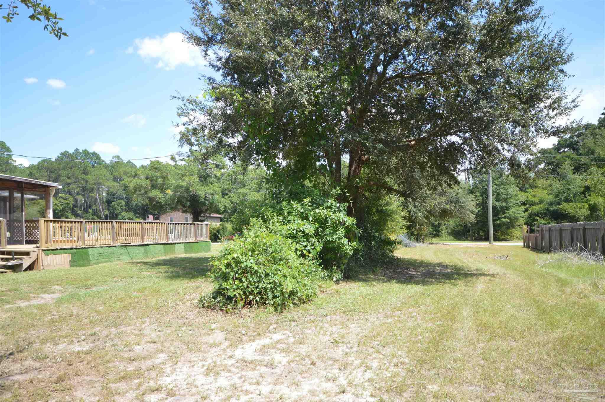4163 Woodville Road Milton, FL 32583 - Photo 34 of 35 a view of a backyard with swimming pool
