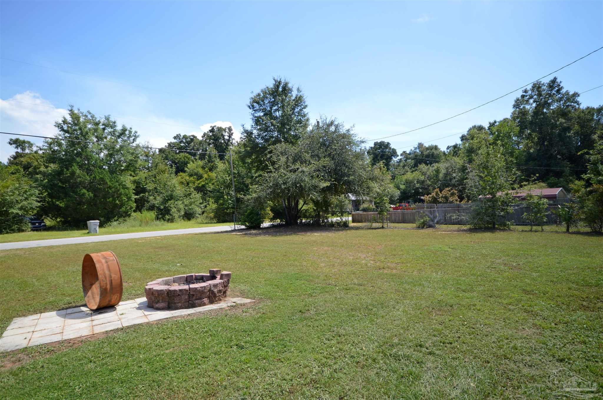 4163 Woodville Road Milton, FL 32583 - Photo 4 of 35 a view of a outdoor space