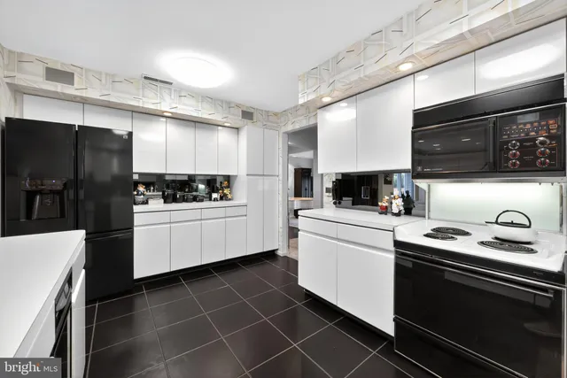 a kitchen with a sink a stove and refrigerator