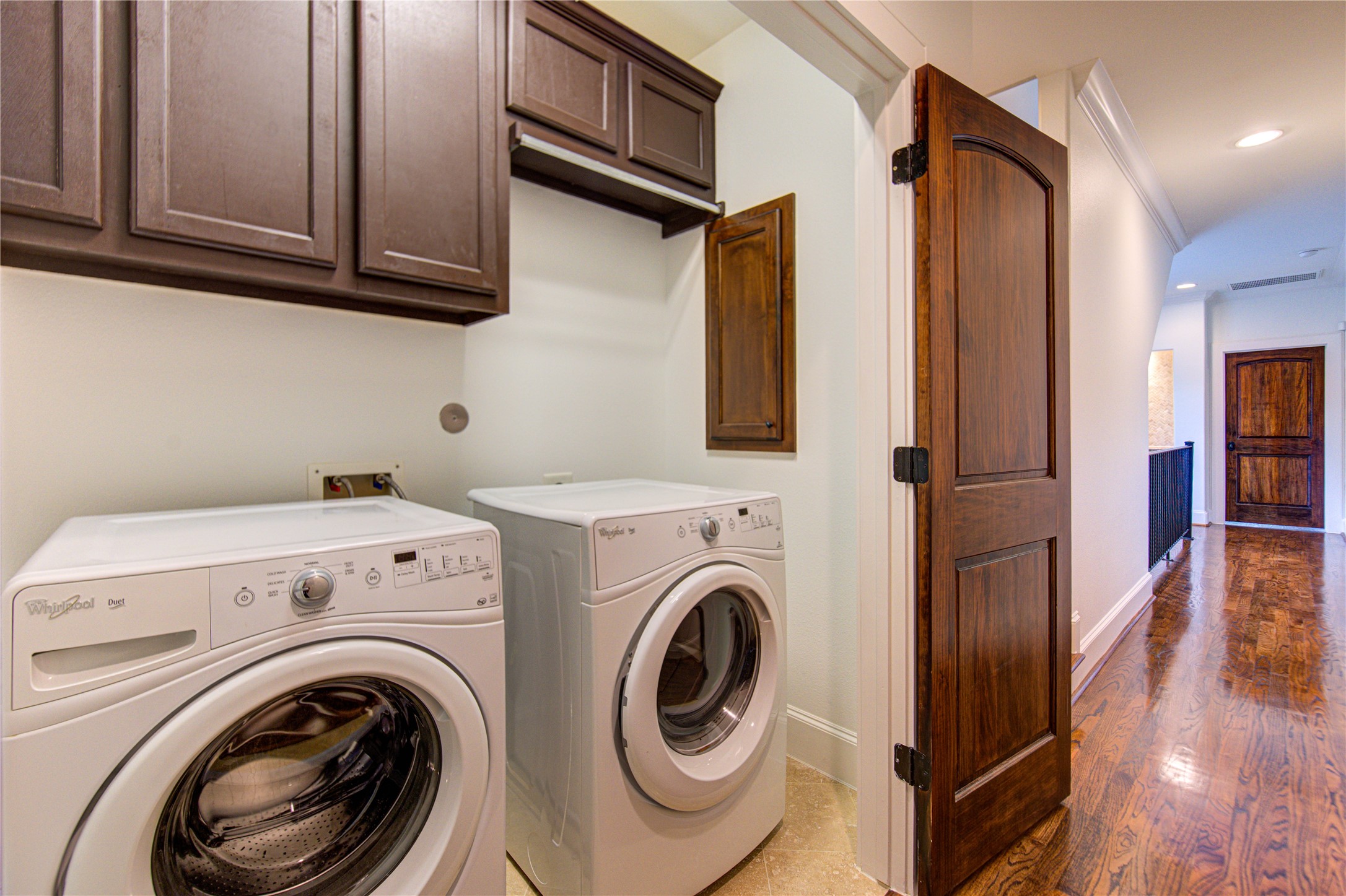 6520 Rodrigo Street Houston, TX 77007 - Photo 32 of 44 Second-floor laundry area with overhead storage, conveniently located next to the primary bedroom