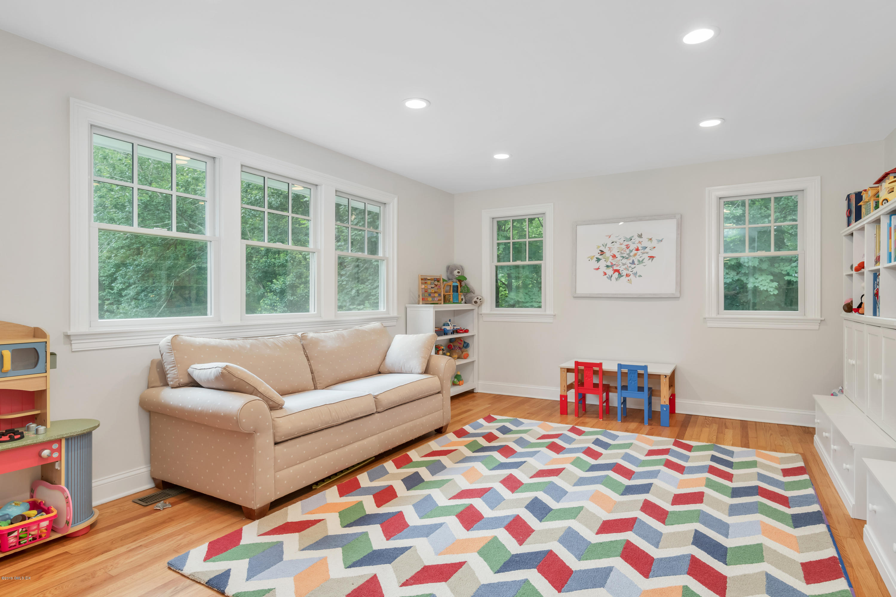 94 Cognewaugh Road Cos Cob, CT 06807 - Photo 12 of 25 a living room with furniture and a potted plant