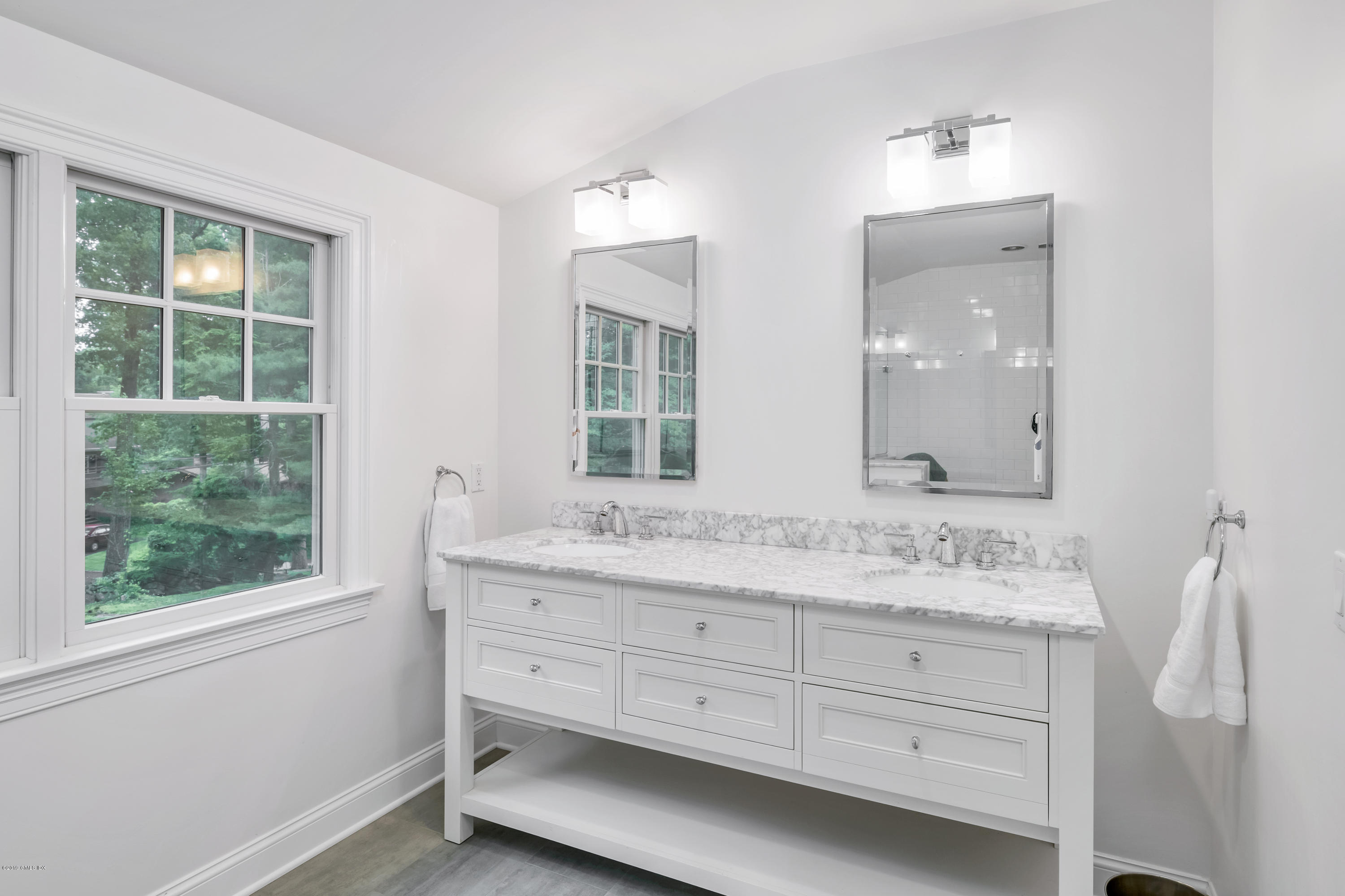 94 Cognewaugh Road Cos Cob, CT 06807 - Photo 15 of 25 a bathroom with a granite countertop sink mirror and double