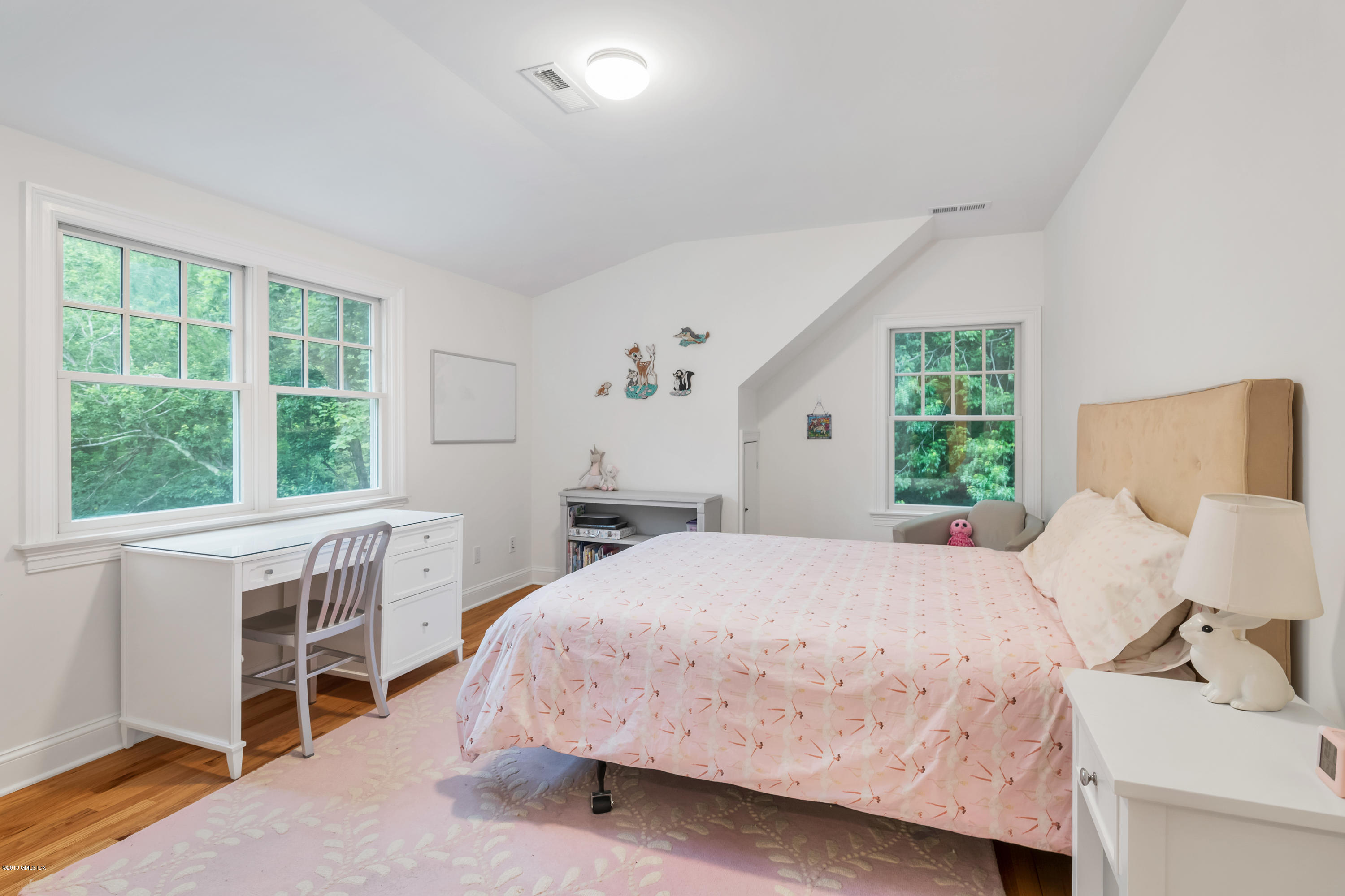 94 Cognewaugh Road Cos Cob, CT 06807 - Photo 18 of 25 a bedroom with a bed and a large window
