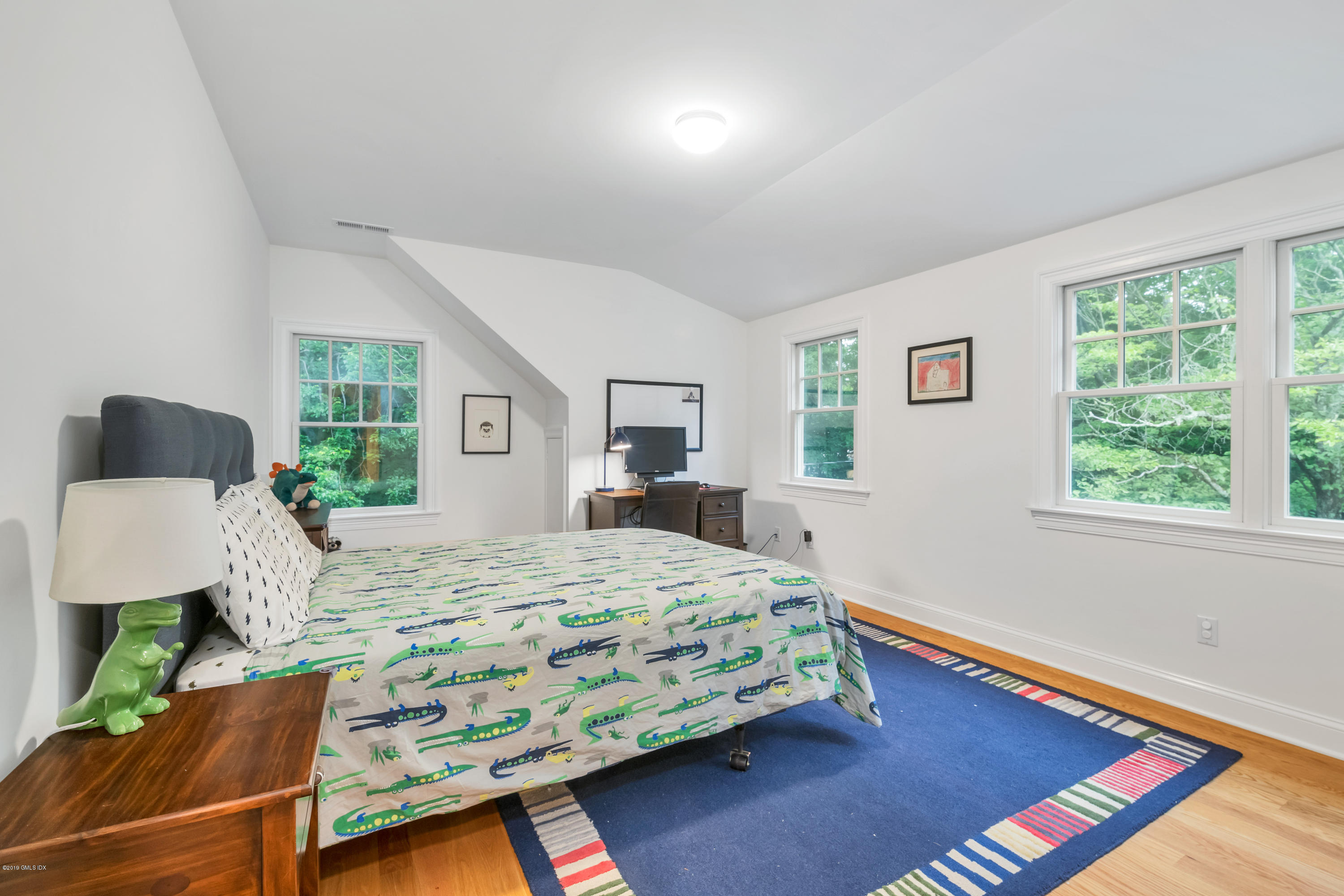 94 Cognewaugh Road Cos Cob, CT 06807 - Photo 19 of 25 a bedroom with a bed window and table