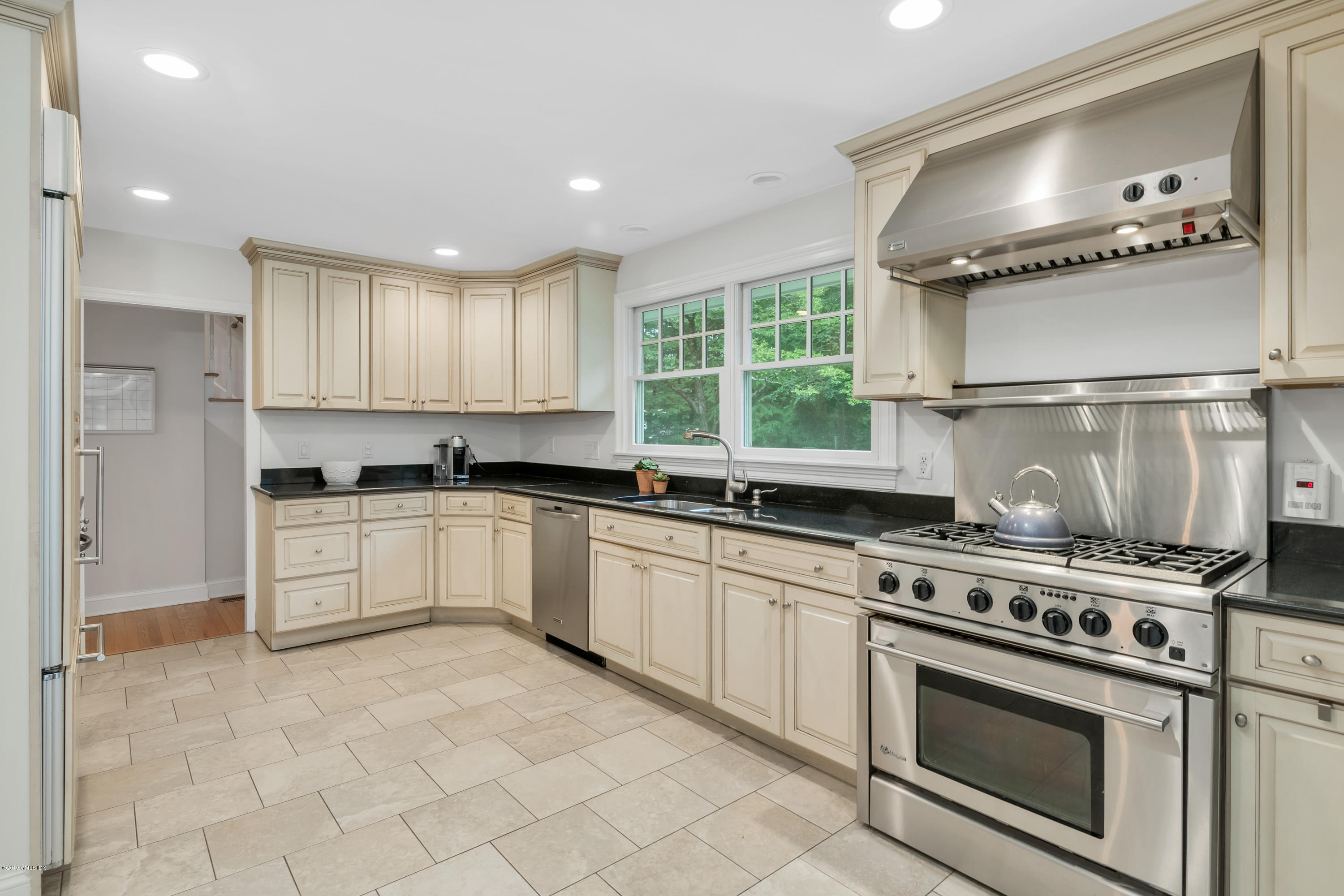 94 Cognewaugh Road Cos Cob, CT 06807 - Photo 4 of 25 a kitchen with a stove a sink and a refrigerator