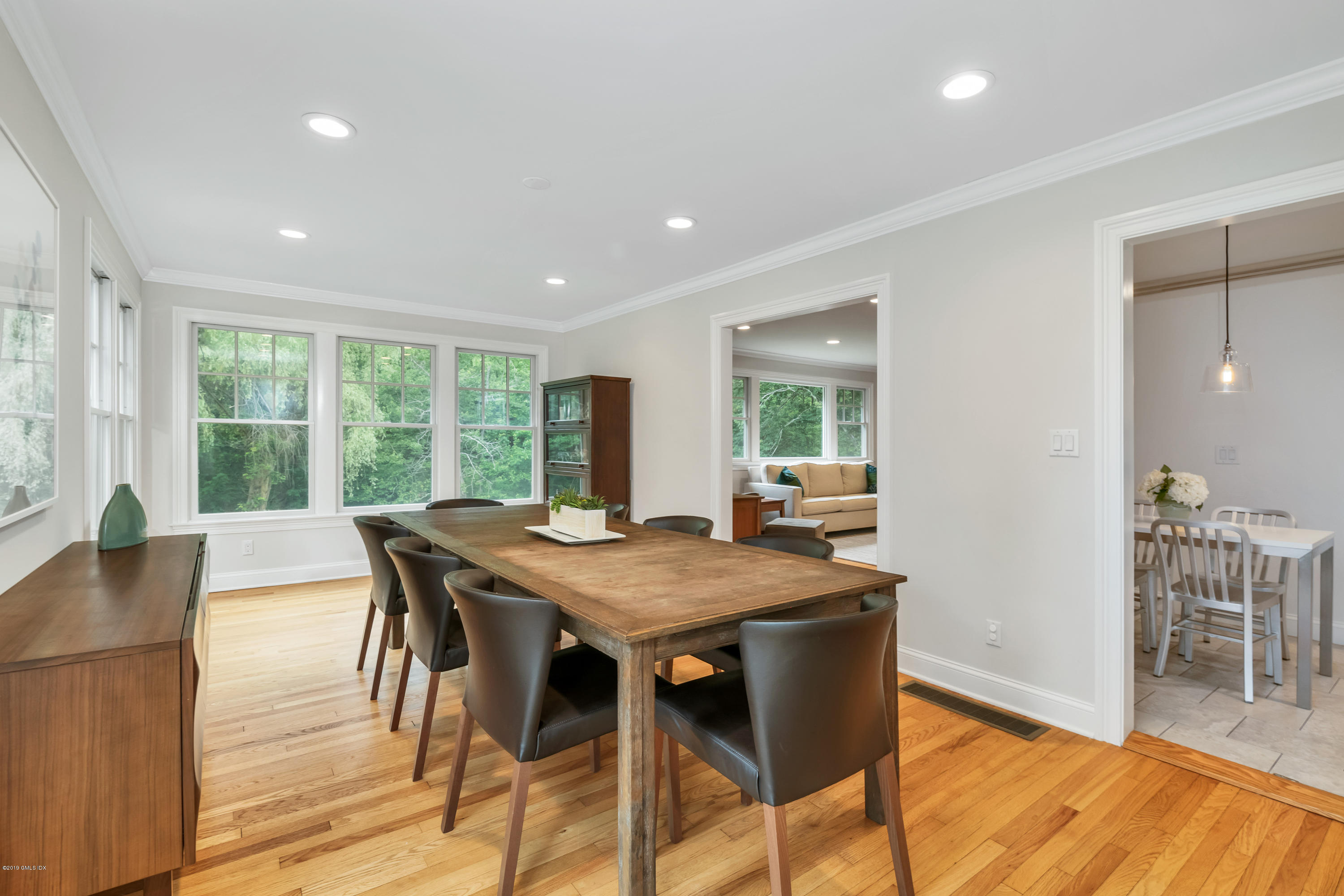 94 Cognewaugh Road Cos Cob, CT 06807 - Photo 7 of 25 a view of a dining room with furniture window and wooden floor