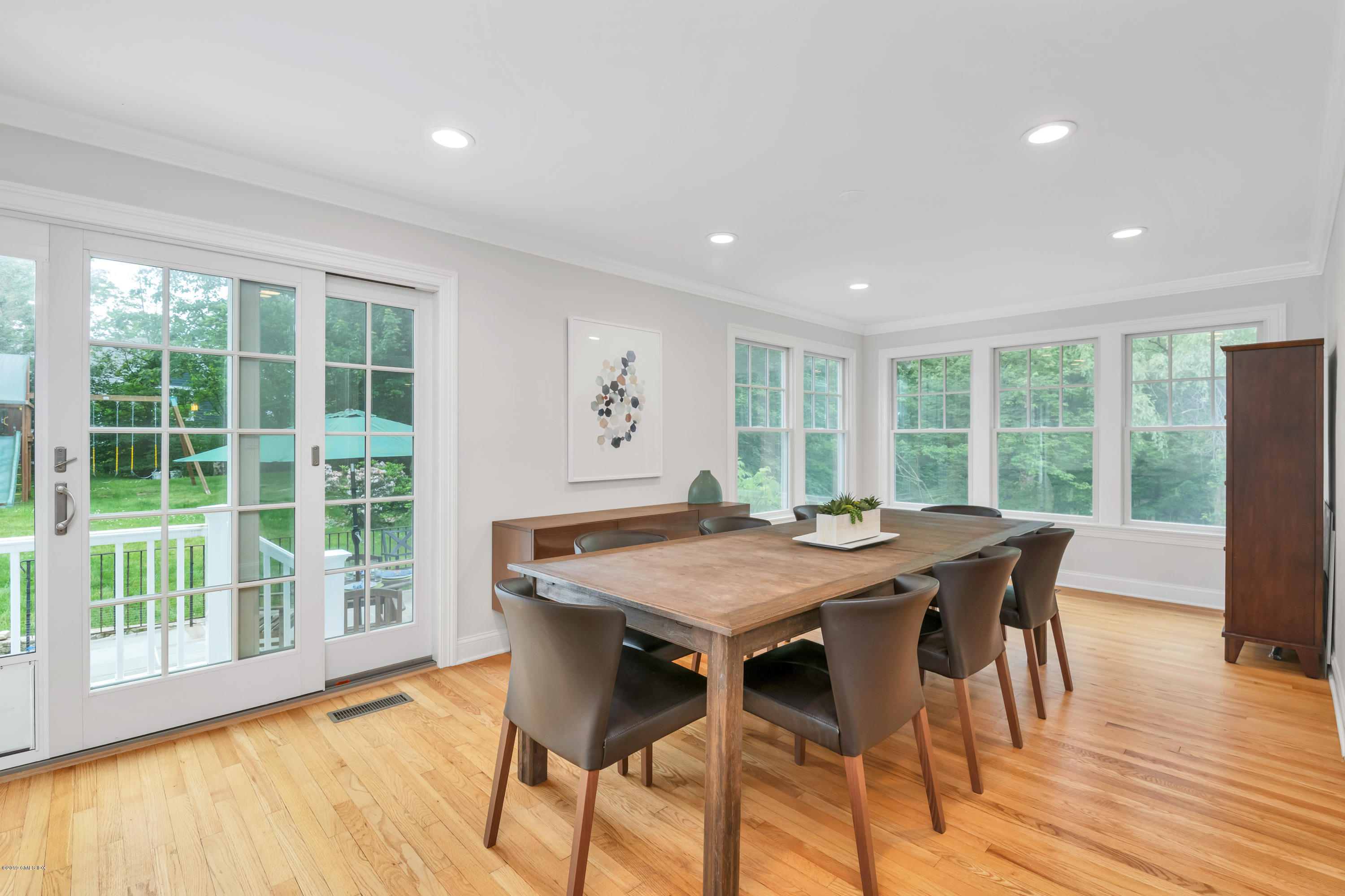 94 Cognewaugh Road Cos Cob, CT 06807 - Photo 8 of 25 a view of a dining room with furniture window and wooden floor