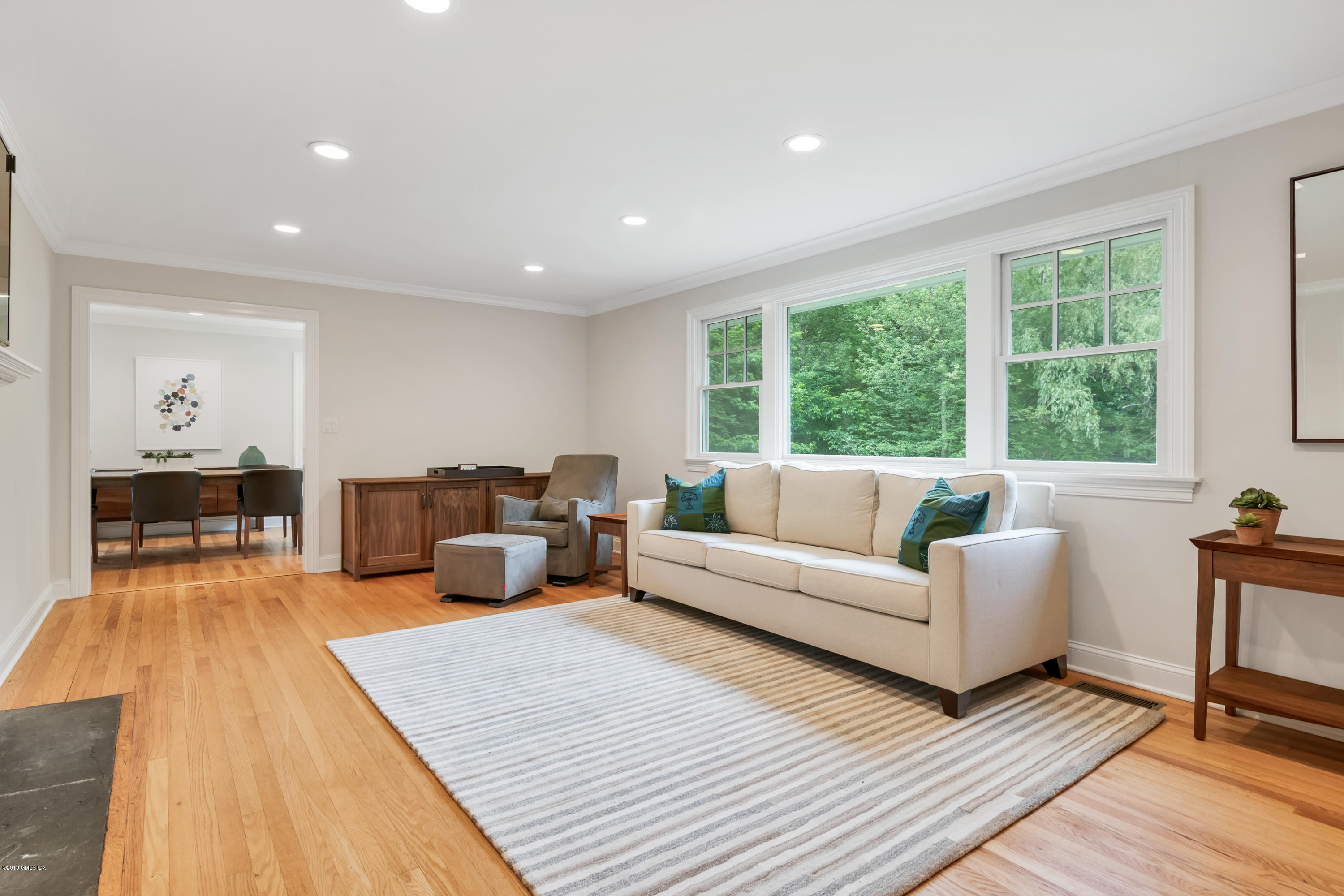 94 Cognewaugh Road Cos Cob, CT 06807 - Photo 9 of 25 a living room with furniture and a large window