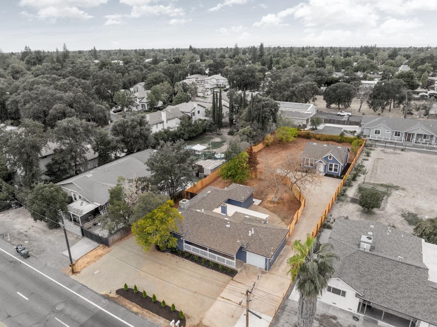 an aerial view of residential houses with outdoor space