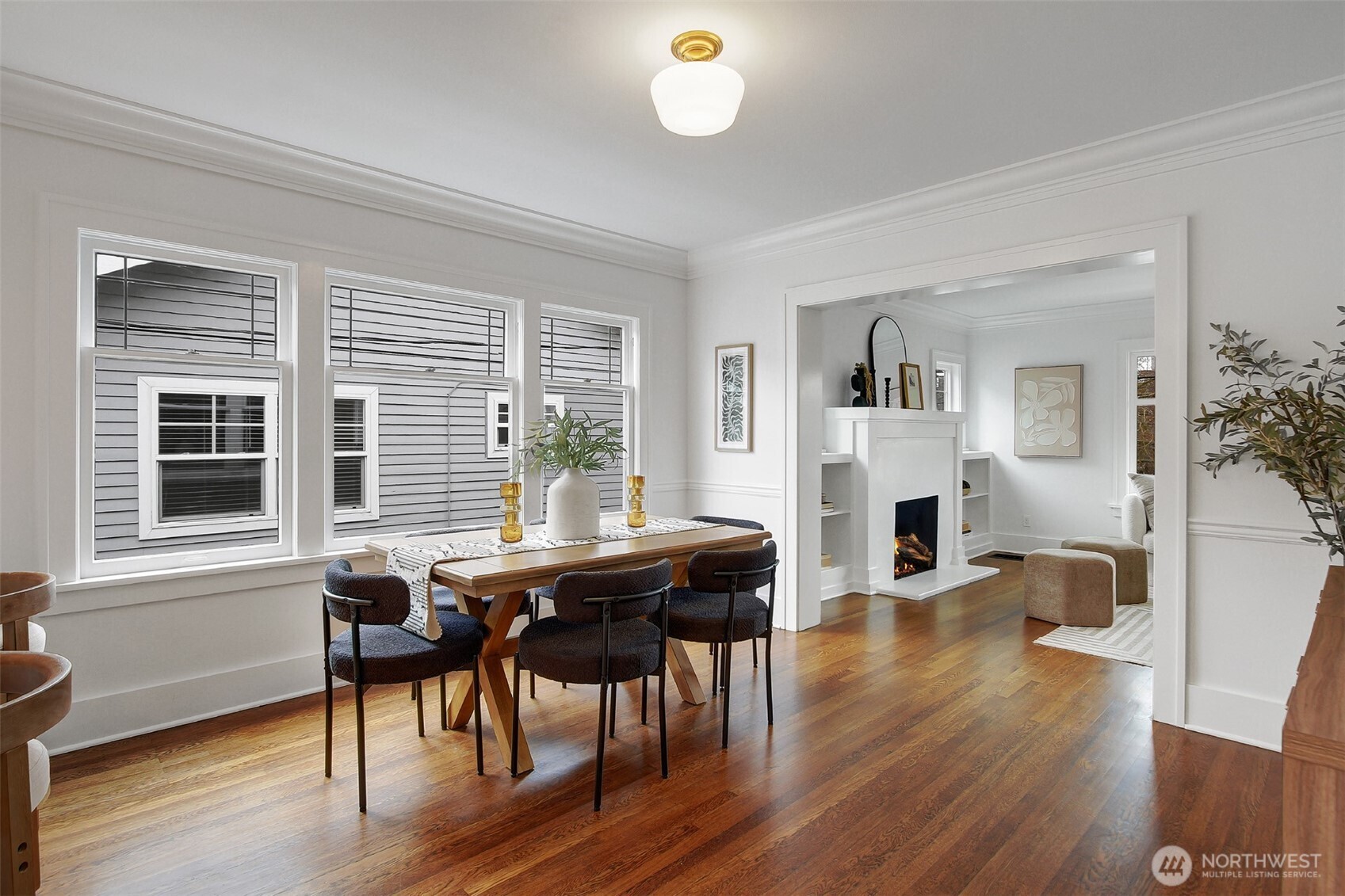 720 North 46th Street Seattle, WA 98103 - Photo 12 of 32 a view of a dining room with furniture window and wooden floor