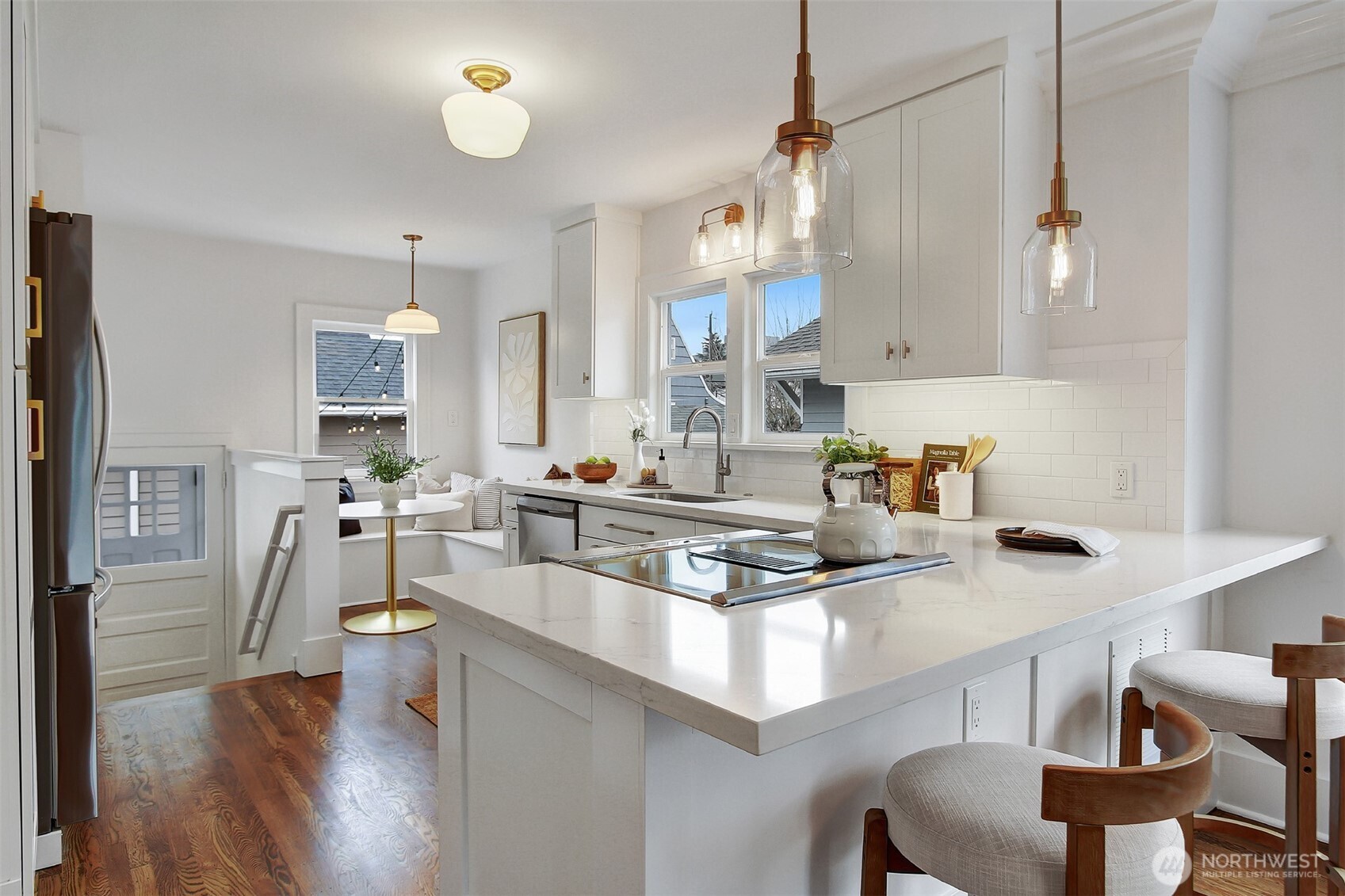 720 North 46th Street Seattle, WA 98103 - Photo 14 of 32 a kitchen with white cabinets and appliances