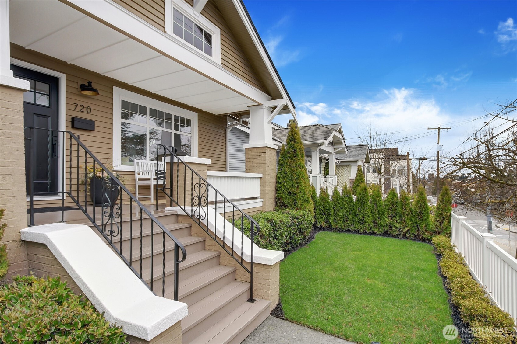 720 North 46th Street Seattle, WA 98103 - Photo 2 of 32 a view of a patio with couches table and chairs and potted plants