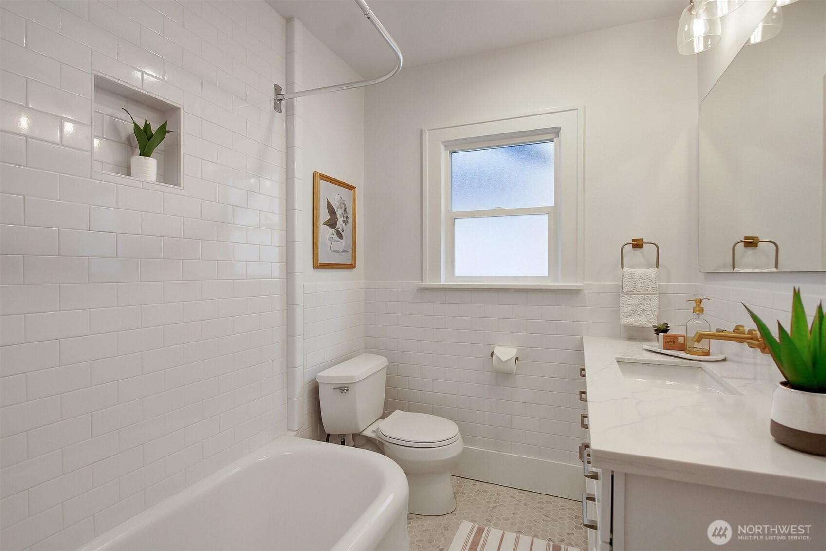 720 North 46th Street Seattle, WA 98103 - Photo 22 of 32 a bathroom with a sink a toilet and shower