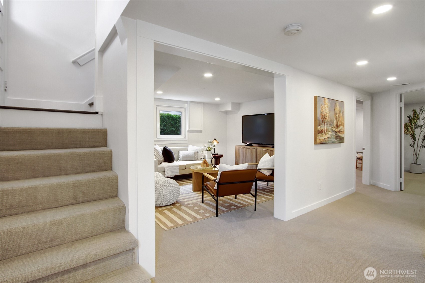 720 North 46th Street Seattle, WA 98103 - Photo 24 of 32 a living room with furniture and a flat screen tv