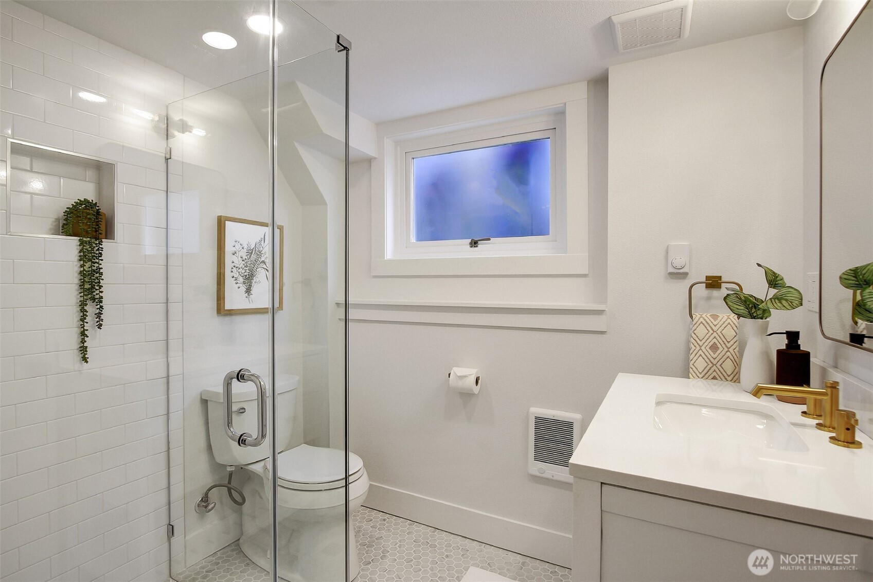 720 North 46th Street Seattle, WA 98103 - Photo 27 of 32 a bathroom with a sink and mirror