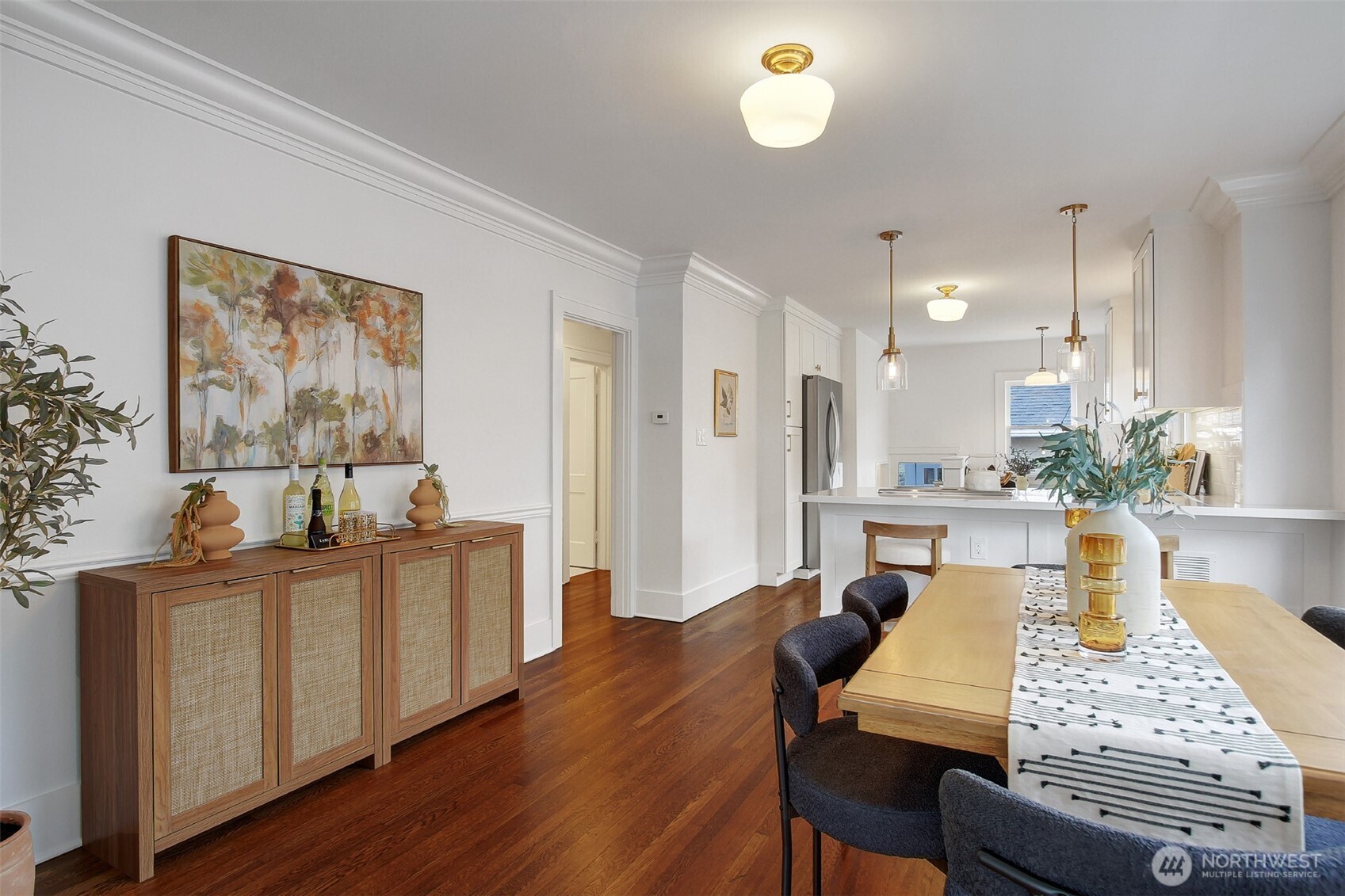 720 North 46th Street Seattle, WA 98103 - Photo 10 of 32 a view of a dining room with furniture and wooden floor