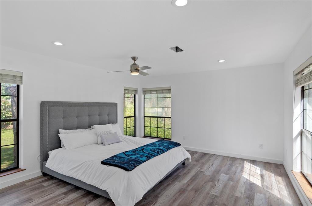 1400 East Shady Grove Road Irving, TX 75060 - Photo 13 of 39 a bedroom with a bed and a window