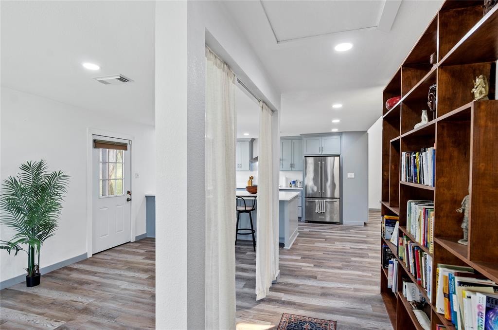 1400 East Shady Grove Road Irving, TX 75060 - Photo 14 of 39 a view of a hallway with wooden floor and entryway