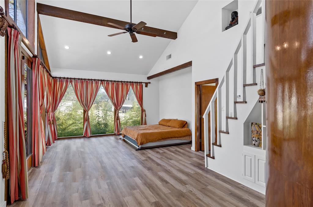 1400 East Shady Grove Road Irving, TX 75060 - Photo 17 of 39 a view of empty room with wooden floor and fan