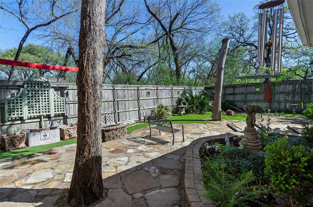 1400 East Shady Grove Road Irving, TX 75060 - Photo 21 of 39 a view of a bench in a backyard