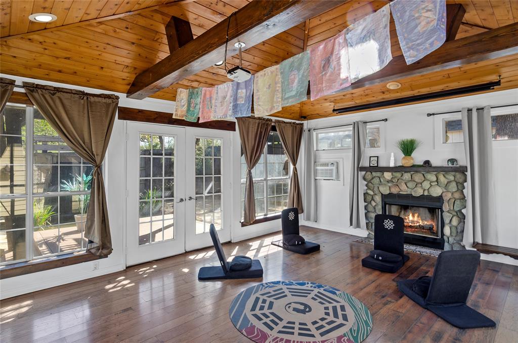 1400 East Shady Grove Road Irving, TX 75060 - Photo 25 of 39 a living room with furniture floor to ceiling window and a fireplace