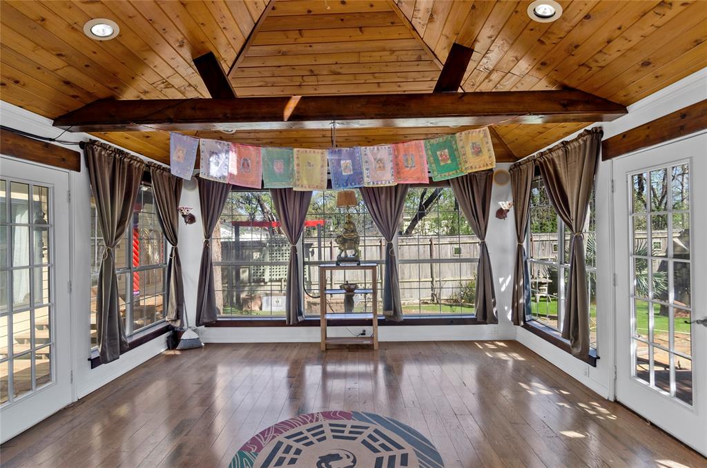1400 East Shady Grove Road Irving, TX 75060 - Photo 26 of 39 an empty room with wooden floor and windows