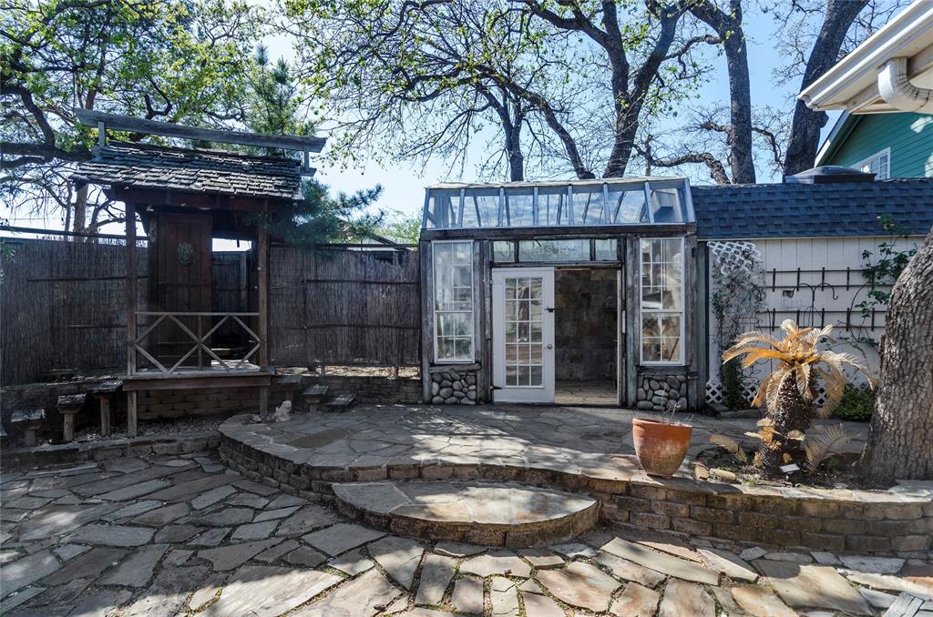 1400 East Shady Grove Road Irving, TX 75060 - Photo 27 of 39 a view of a chair and tables in backyard of the house