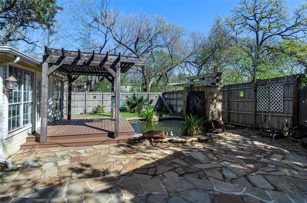 1400 East Shady Grove Road Irving, TX 75060 - Photo 29 of 39 a backyard of a house with yard and outdoor seating