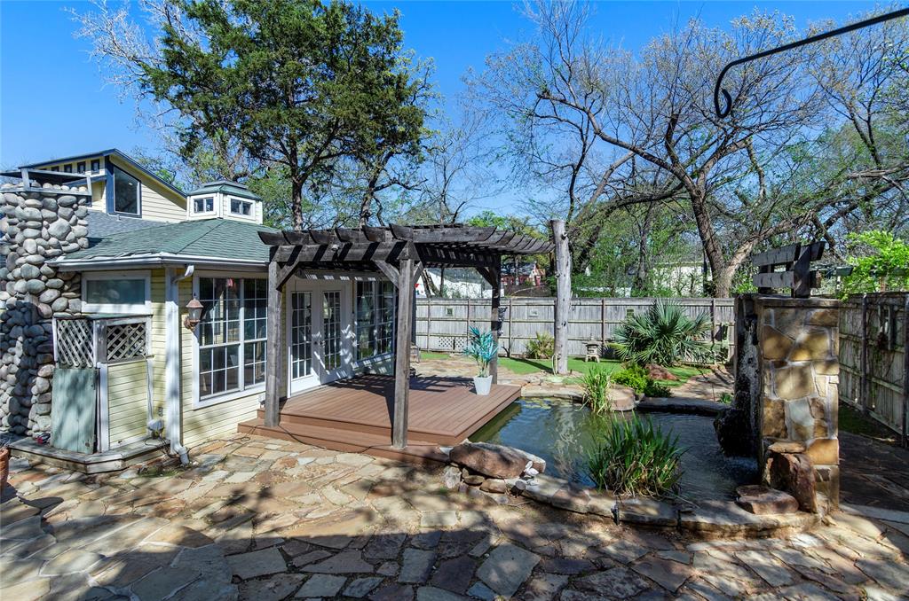 1400 East Shady Grove Road Irving, TX 75060 - Photo 31 of 39 a front view of a house with a tree