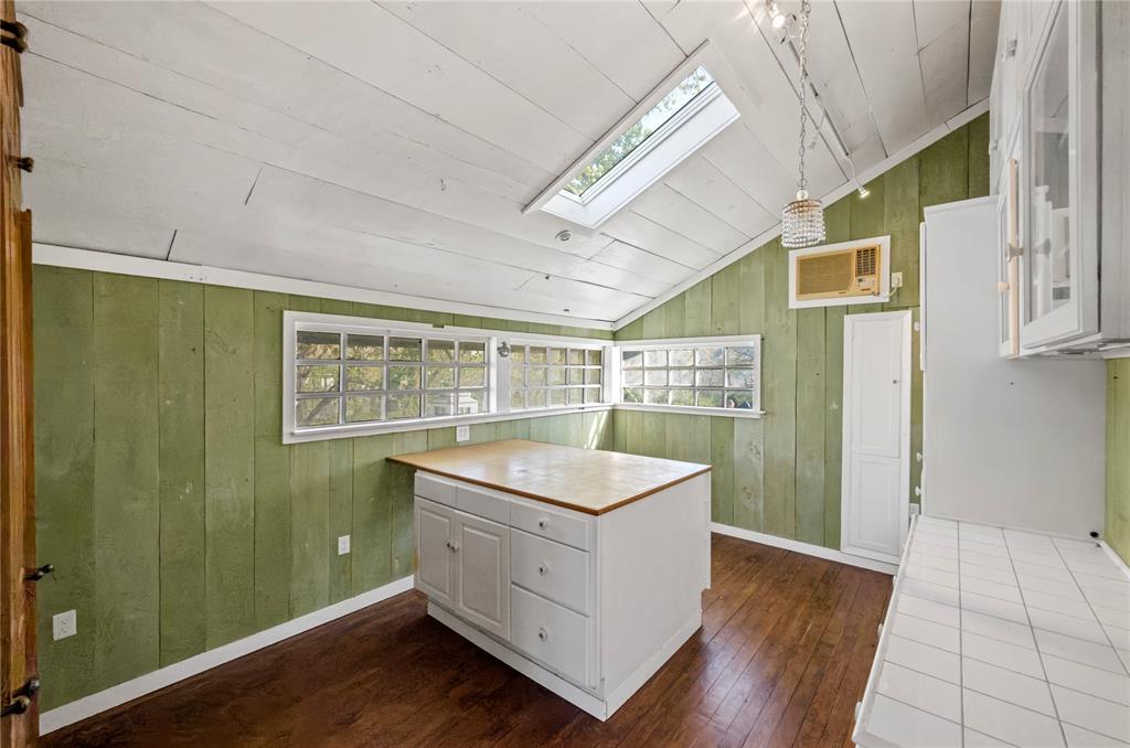 1400 East Shady Grove Road Irving, TX 75060 - Photo 37 of 39 a room with window and wooden floor