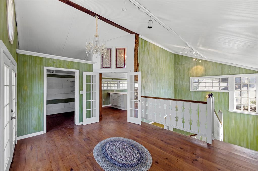 1400 East Shady Grove Road Irving, TX 75060 - Photo 38 of 39 a living room with furniture and a wooden floor