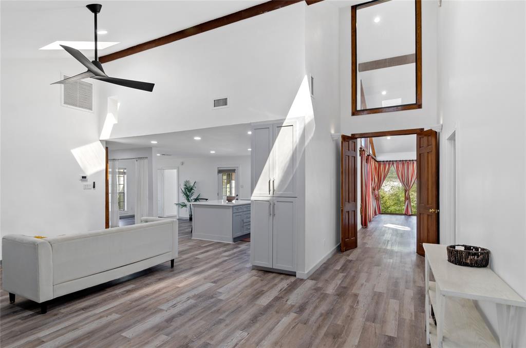 1400 East Shady Grove Road Irving, TX 75060 - Photo 5 of 39 a view of a hallway view with wooden floor and staircase