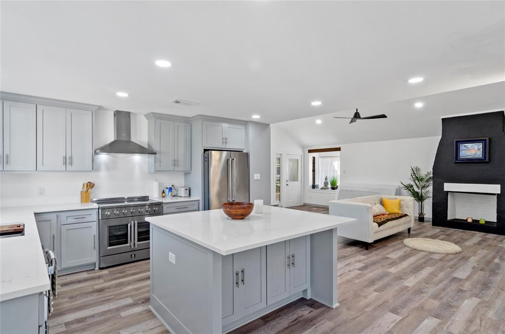 1400 East Shady Grove Road Irving, TX 75060 - Photo 8 of 39 a kitchen with refrigerator and cabinets