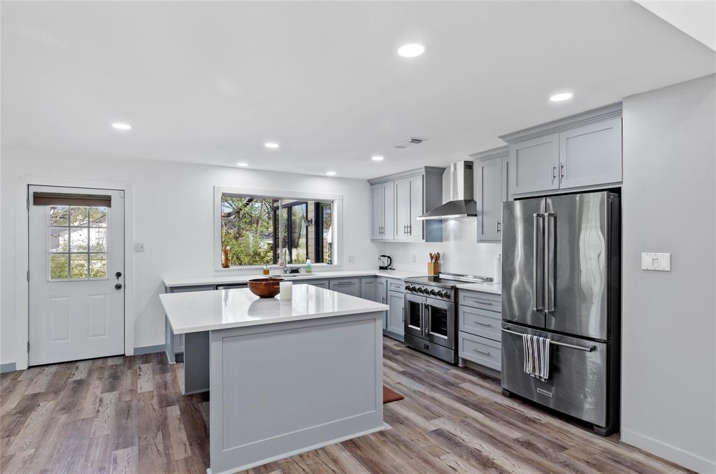 1400 East Shady Grove Road Irving, TX 75060 - Photo 9 of 39 a kitchen with a sink stainless steel appliances and cabinets