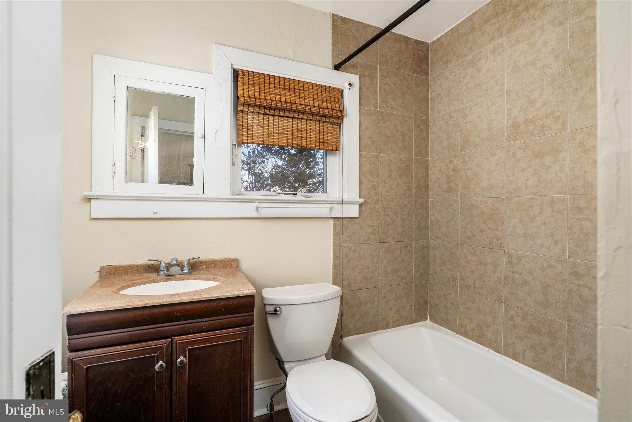 75 Patton Avenue, Unit 1 Princeton, NJ 08540 - Photo 11 of 20 a bathroom with a sink a toilet and a mirror