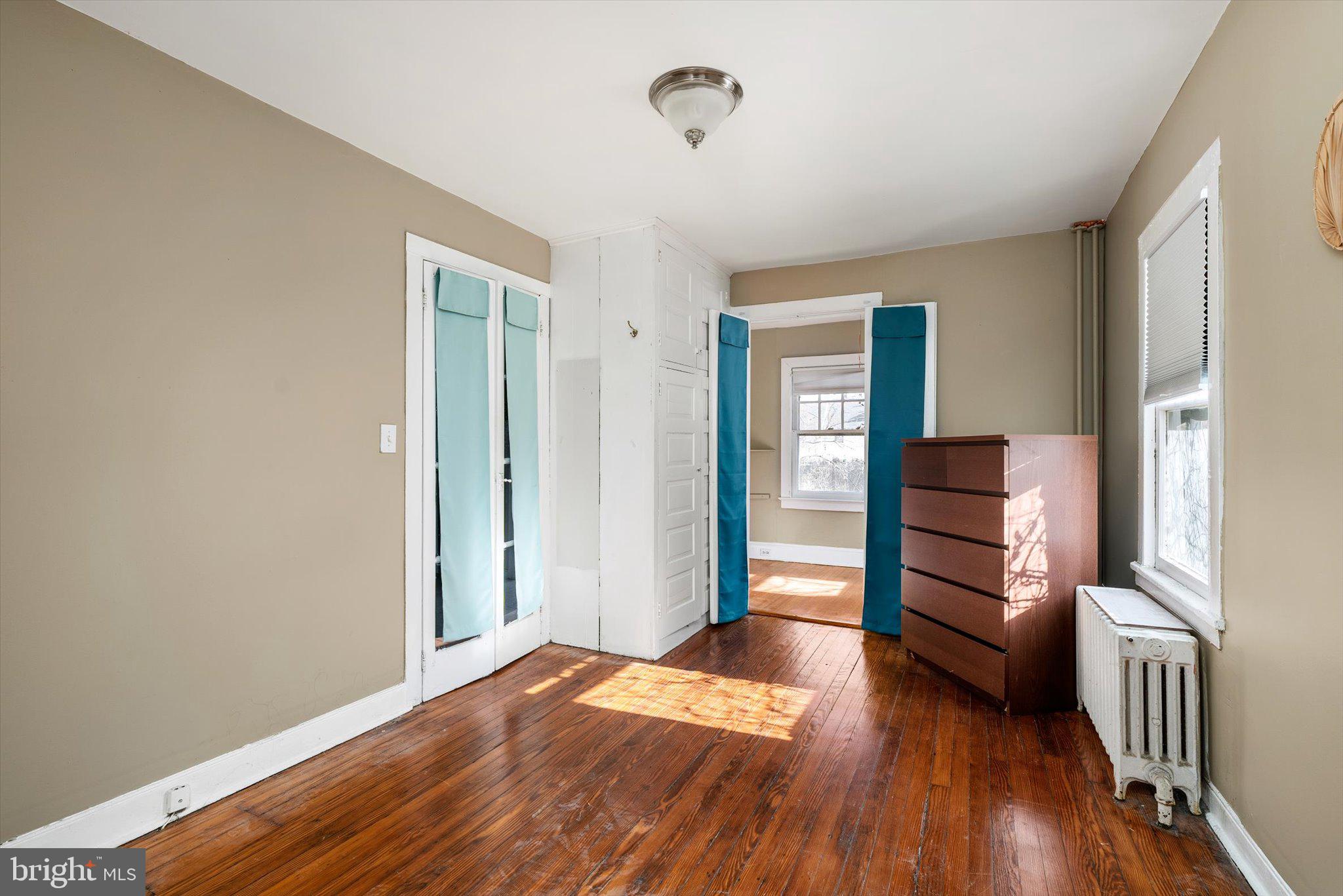 75 Patton Avenue, Unit 1 Princeton, NJ 08540 - Photo 13 of 20 wooden floor in an empty room with a window