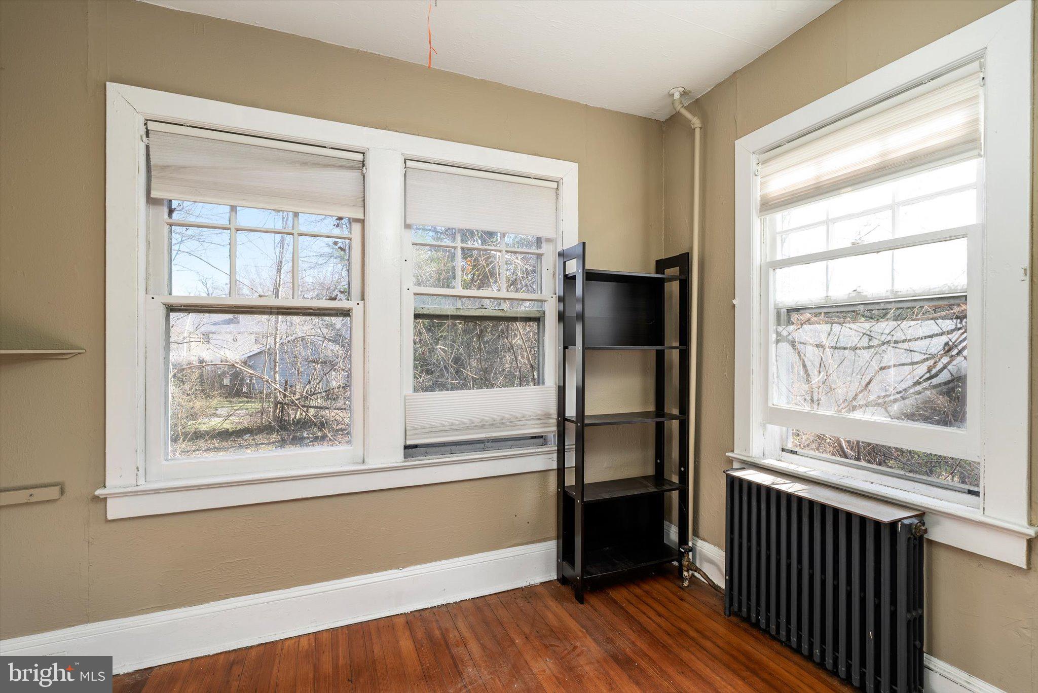 75 Patton Avenue, Unit 1 Princeton, NJ 08540 - Photo 15 of 20 a view of empty room with wooden floor and fan