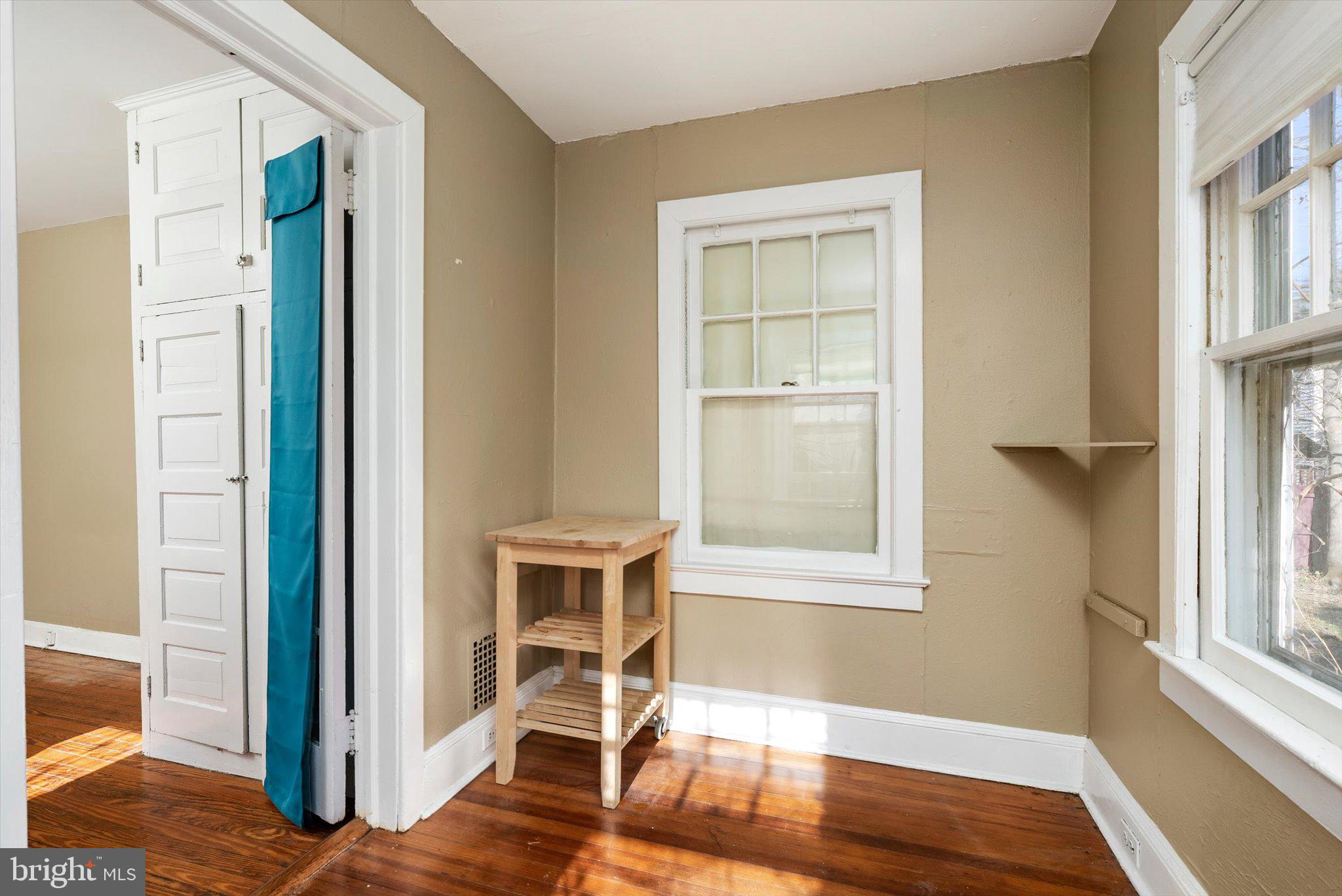 75 Patton Avenue, Unit 1 Princeton, NJ 08540 - Photo 16 of 20 a view of an empty room with wooden floor and a window