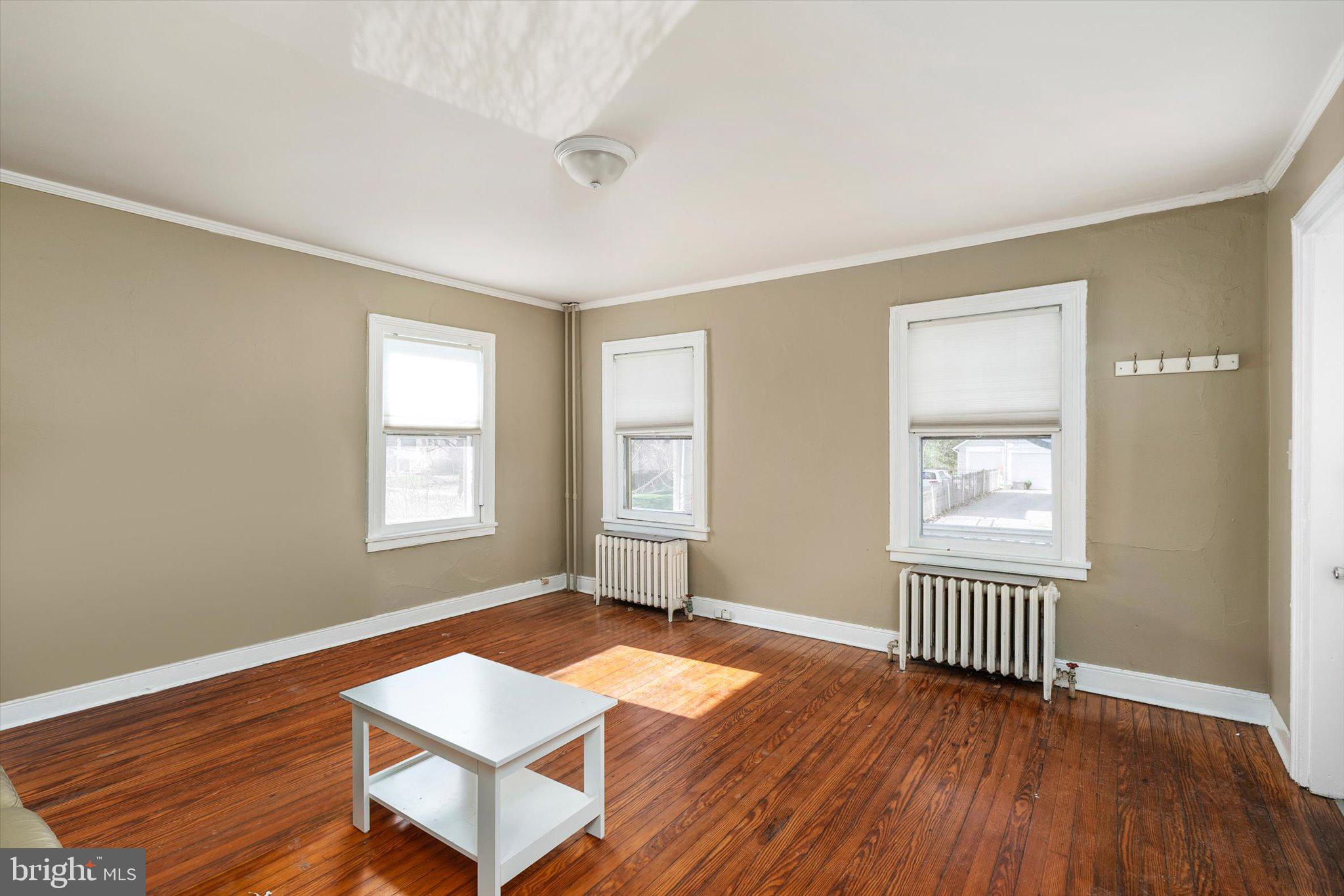 75 Patton Avenue, Unit 1 Princeton, NJ 08540 - Photo 6 of 20 a view of a room with wooden floor and a window