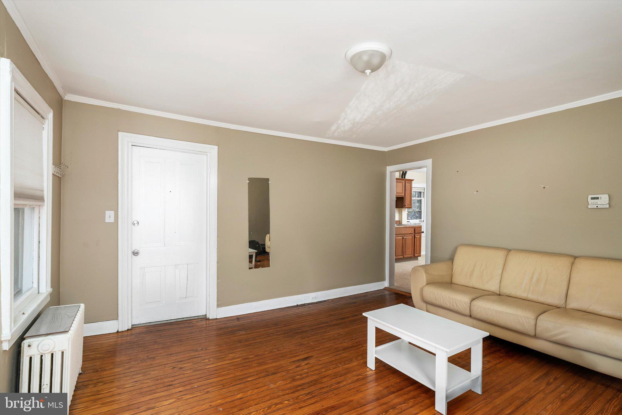 75 Patton Avenue, Unit 1 Princeton, NJ 08540 - Photo 7 of 20 a living room with furniture and a wooden floor